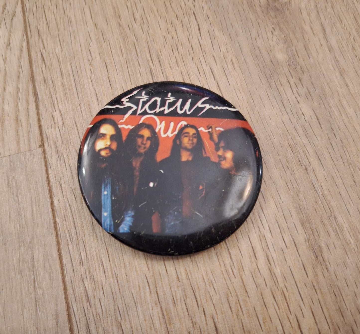 Status quo button 1