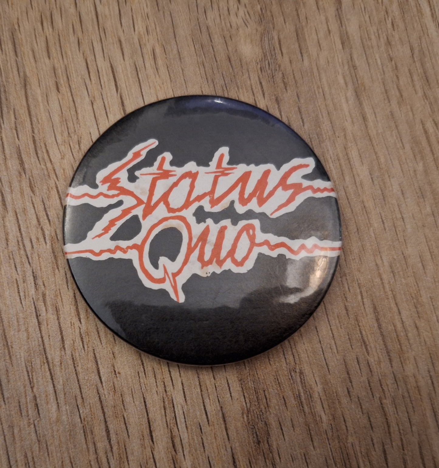 Status quo button 2