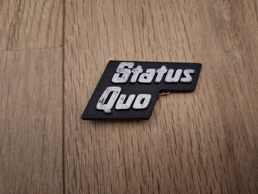 status quo plastic badge